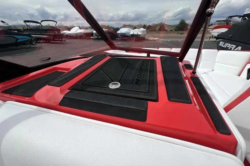 Slide: The Image of 2025 Moomba Max boat interior with red and black accents, showcasing sleek design. - 18