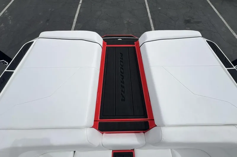 Slide: The Image of 2025 Moomba Max boat deck with white and red accents, viewed from above. - 19