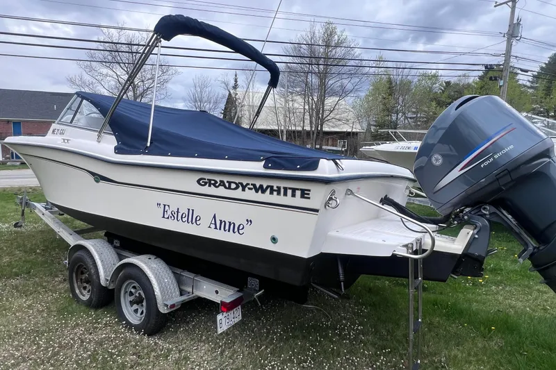 Slide: The Image of 2004 Grady-White Tournament 225 boat on trailer with Yamaha outboard motor. - 4