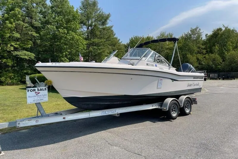 The Image of 2005 Grady-White Tournament 225 boat on trailer, for sale sign visible. - 1