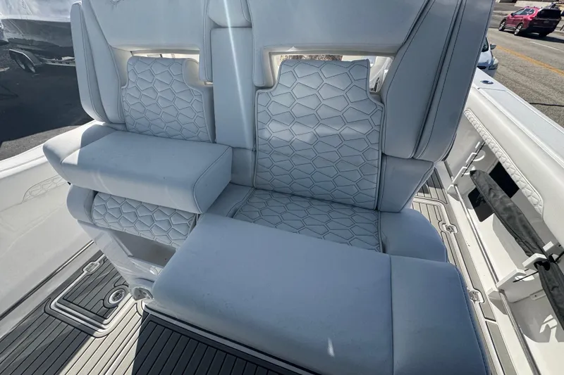 Slide: The Image of 2026 Tidewater 320 CC Adventure boat with luxurious white seating and modern design. - 10