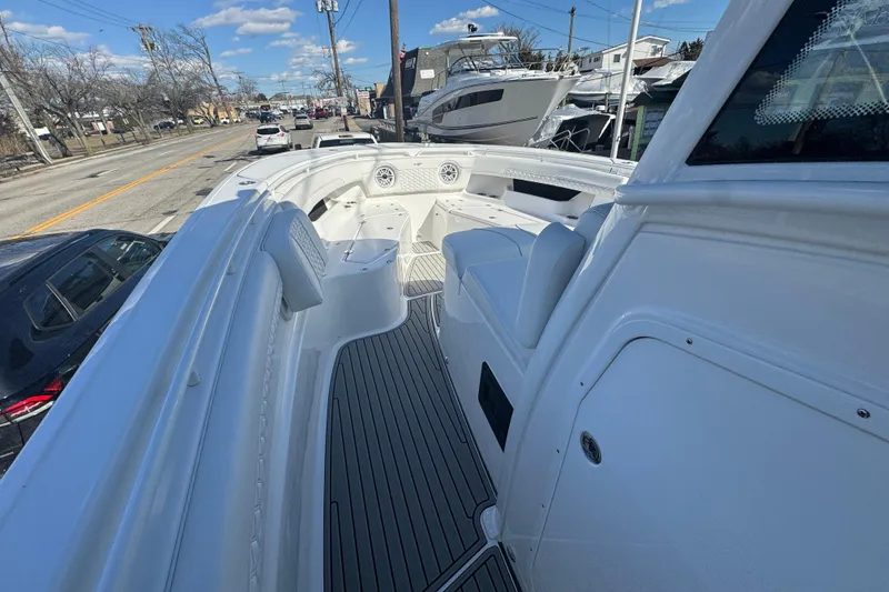 Slide: The Image of 2026 Tidewater 320 CC Adventure boat with sleek white interior and modern design. - 12