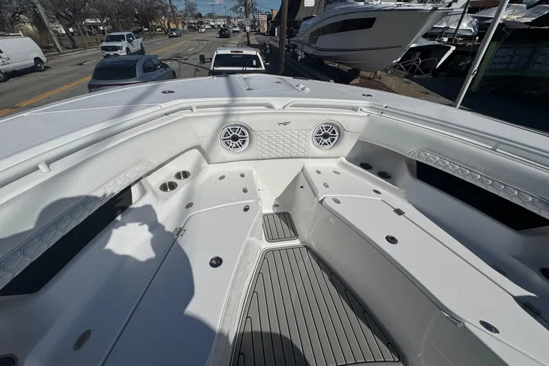 Slide: The Image of 2026 Tidewater 320 CC Adventure boat interior with seating and speakers. - 20