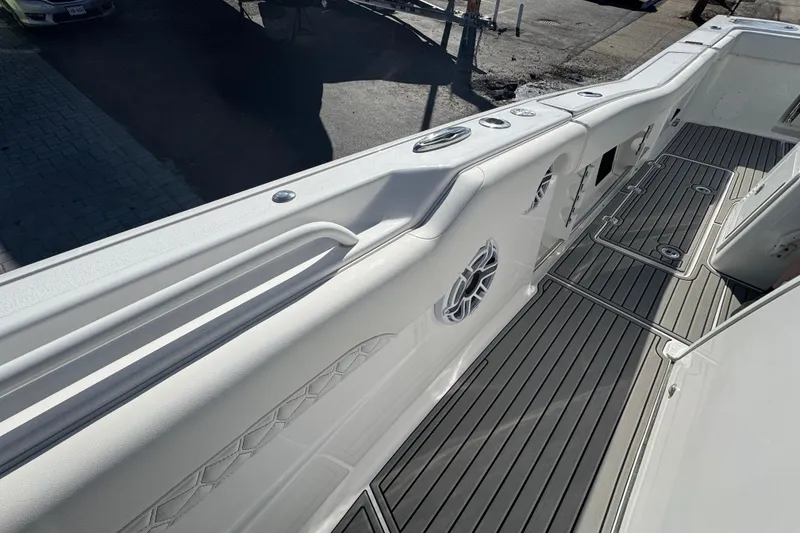 Slide: The Image of 2026 Tidewater 320 CC Adventure boat deck with sleek design and modern features. - 22