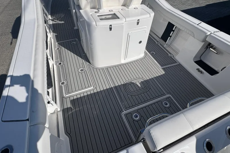 Slide: The Image of 2026 Tidewater 320 CC Adventure boat deck with sleek, modern design and ample storage. - 3