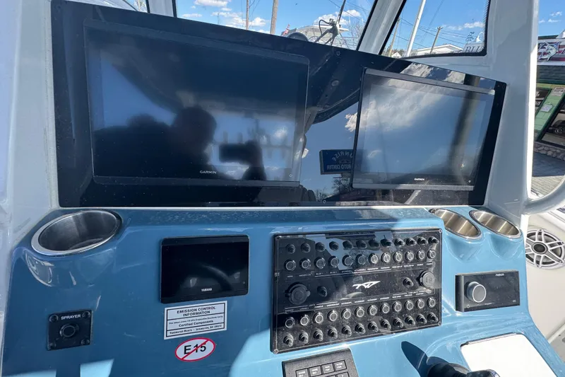 Slide: The Image of Control panel of 2026 Tidewater 320 CC Adventure boat with dual Garmin screens. - 9