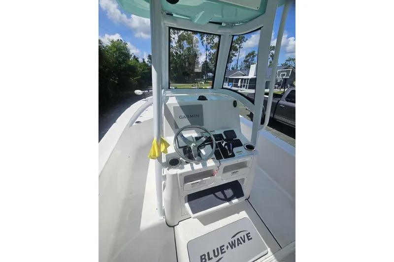 Slide: The Image of 2022 Blue Wave 2800 Pure Hybrid boat interior with Garmin navigation system. - 3