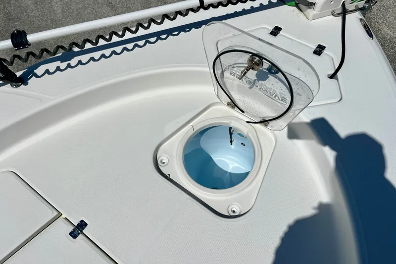 Slide: The Image of 2022 Blue Wave 2800 Pure Hybrid boat with open hatch and livewell. - 24