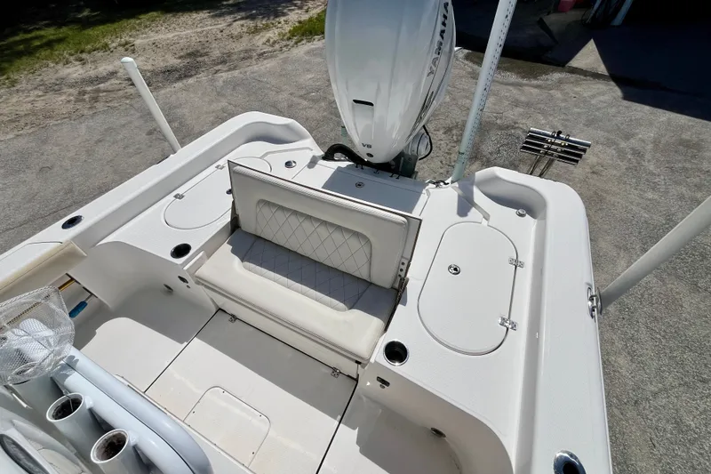 Slide: The Image of 2022 Blue Wave 2800 Pure Hybrid boat interior with seating and storage compartments. - 10