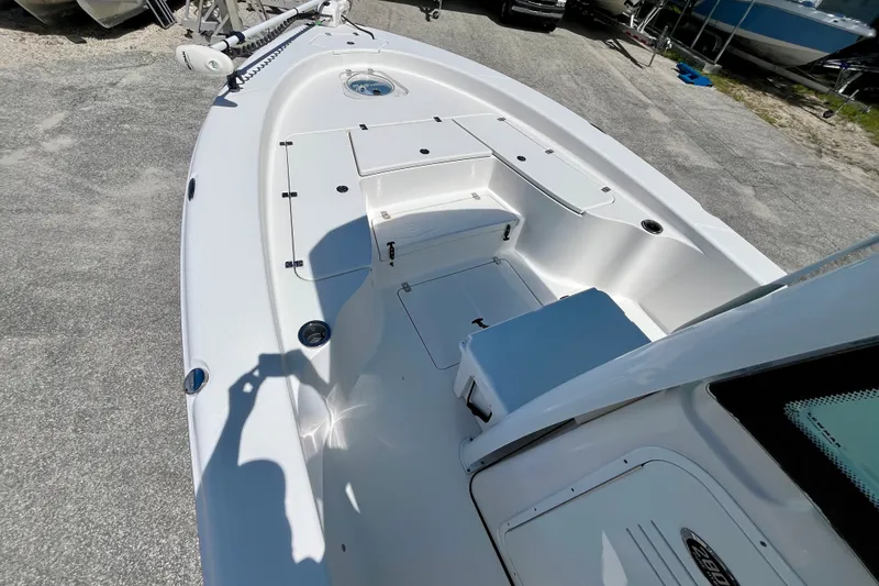 Slide: The Image of 2022 Blue Wave 2800 Pure Hybrid boat deck with storage compartments and seating. - 20