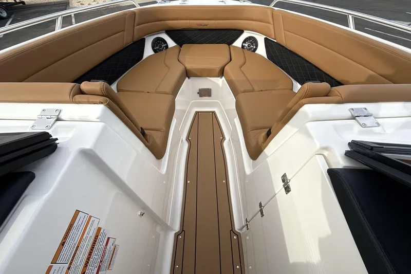 Slide: The Image of 2026 Chaparral GTS 6 boat interior with tan seating and sleek design. - 11