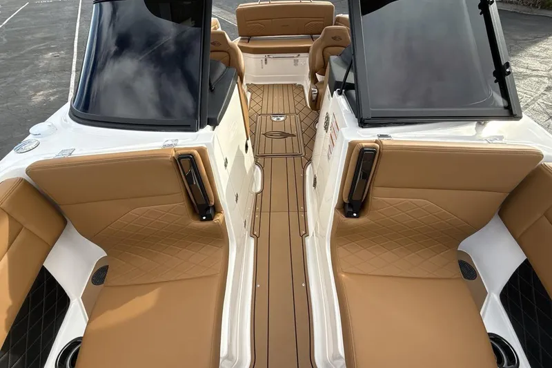 Slide: The Image of 2026 Chaparral GTS 6 boat interior with tan leather seating and sleek design. - 12