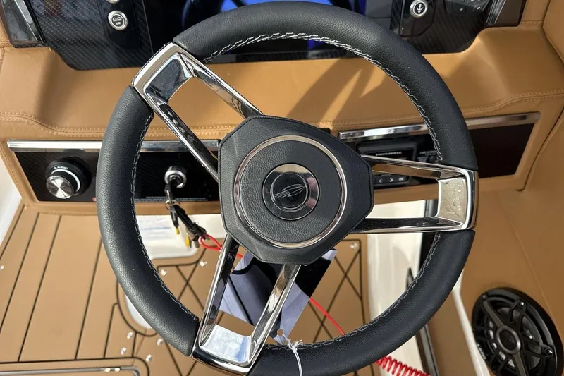 Slide: The Image of Steering wheel of 2026 Chaparral GTS 6 boat with modern dashboard design. - 14