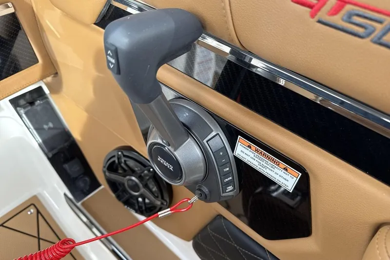 Slide: The Image of 2026 Chaparral GTS 6 throttle control with warning label and speaker detail. - 16