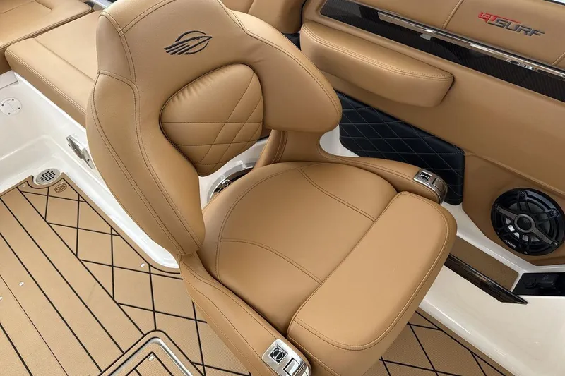Slide: The Image of 2026 Chaparral GTS 6 boat interior with tan leather seating and stylish design. - 17