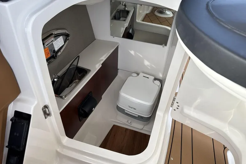 Slide: The Image of 2026 Chaparral GTS 6 boat interior with compact bathroom and sink. - 18