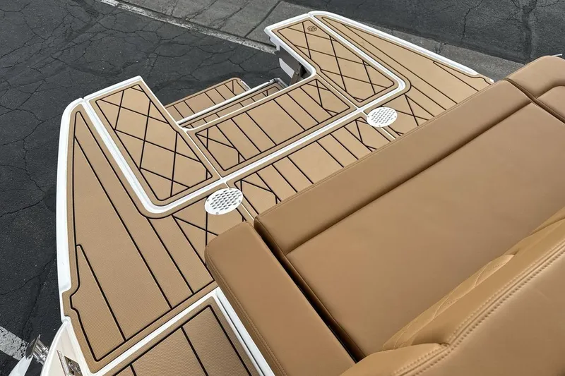 Slide: The Image of 2026 Chaparral GTS 6 boat deck with tan upholstery and stylish design. - 19