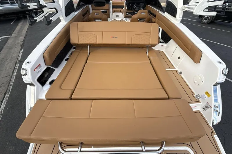 Slide: The Image of 2026 Chaparral GTS 6 boat interior with tan seating and modern design. - 23