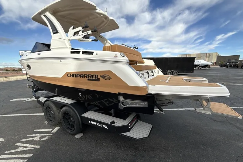 Slide: The Image of 2026 Chaparral GTS 6 boat on trailer, featuring sleek design and modern amenities. - 3