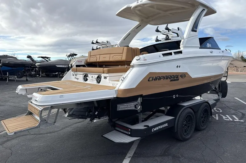 Slide: The Image of 2026 Chaparral GTS 6 boat on trailer, featuring sleek design and modern amenities. - 5