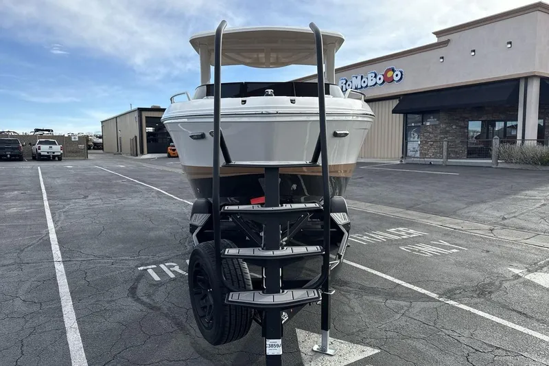 Slide: The Image of 2026 Chaparral GTS 6 boat on trailer in parking lot, rear view. - 8