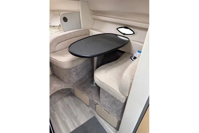 Slide: The Image of 2001 Maxum 2900 SCR cabin interior with seating and table. - 11