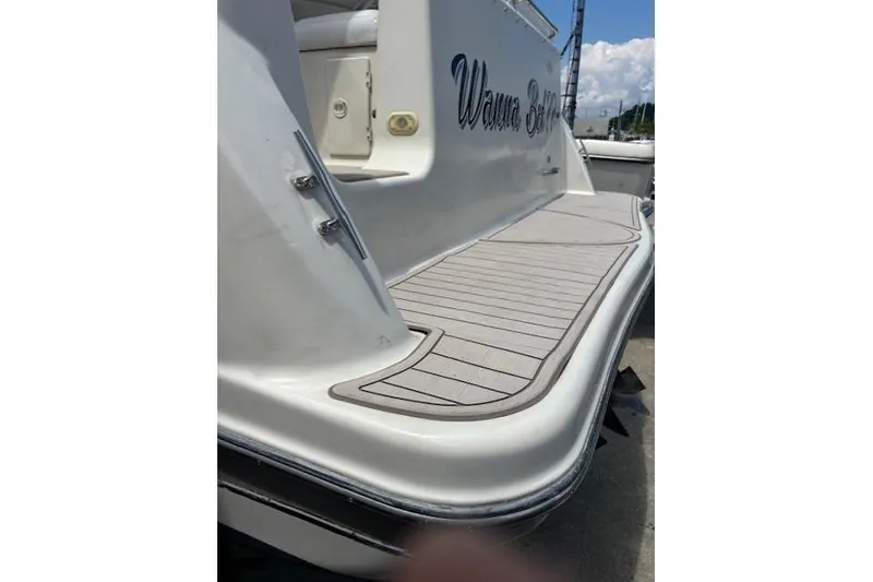 Slide: The Image of 2001 Maxum 2900 SCR boat with sleek swim platform and custom lettering. - 13