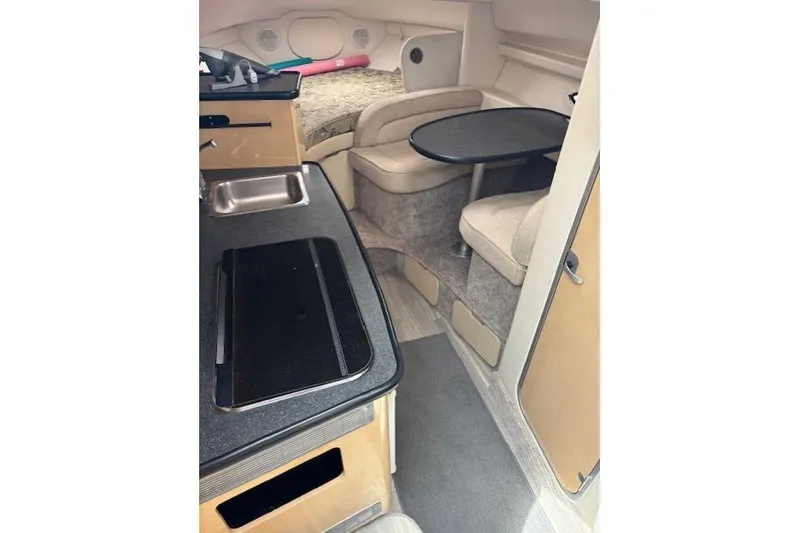 Slide: The Image of 2001 Maxum 2900 SCR cabin interior with kitchenette and seating area. - 6