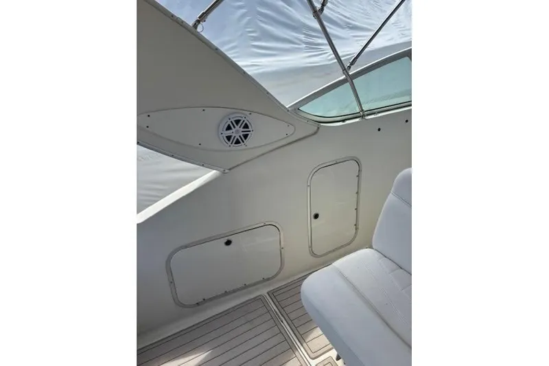 Slide: The Image of Interior view of 2001 Maxum 2900 SCR boat, featuring seating and storage compartments. - 7