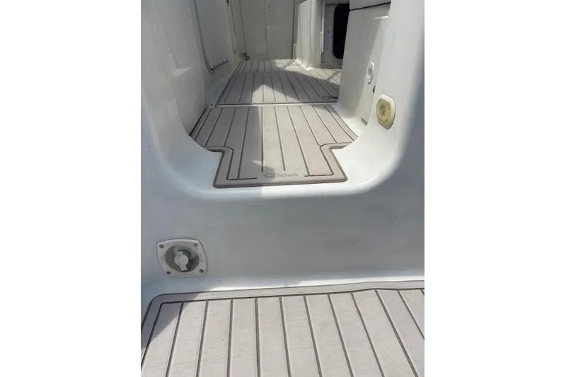 Slide: The Image of 2001 Maxum 2900 SCR boat interior with sleek, modern flooring design. - 8