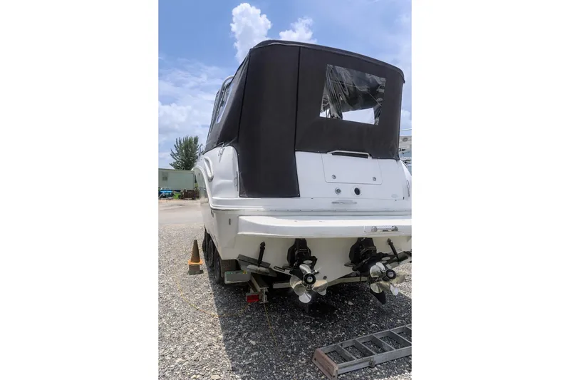 Slide: The Image of Rear view of a 2006 Sea Ray 290 Amberjack on a trailer. - 35