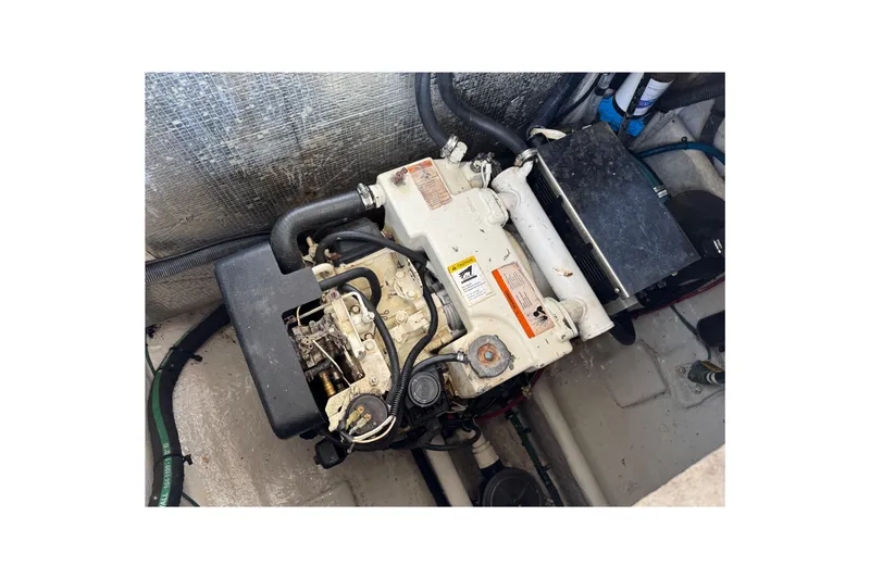 Slide: The Image of Engine compartment of a 2006 Sea Ray 290 Amberjack boat, showcasing mechanical components. - 37