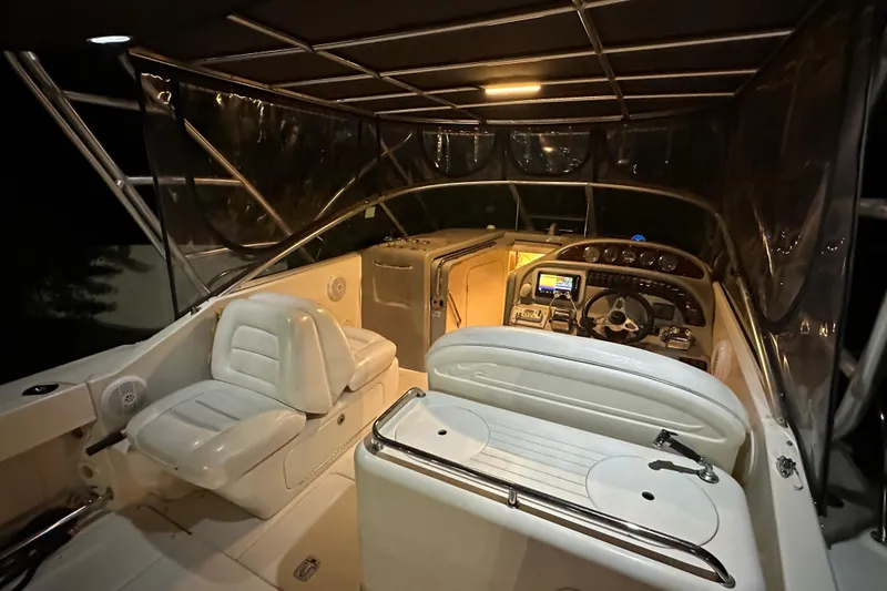 Slide: The Image of 2006 Sea Ray 290 Amberjack boat interior with illuminated cockpit and seating. - 41