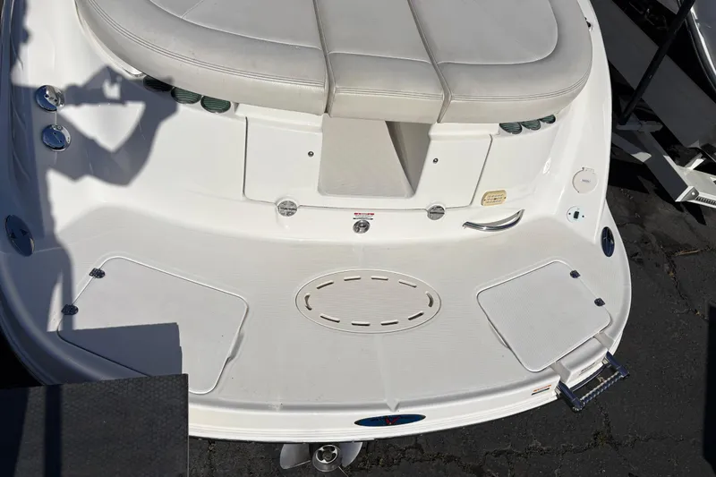 Slide: The Image of 2004 Chaparral 256 SSi boat stern with swim platform and seating area. - 2