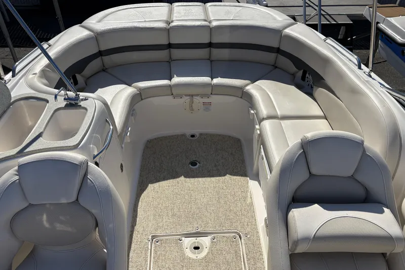 Slide: The Image of 2004 Chaparral 256 SSi boat interior with spacious seating and elegant design. - 5
