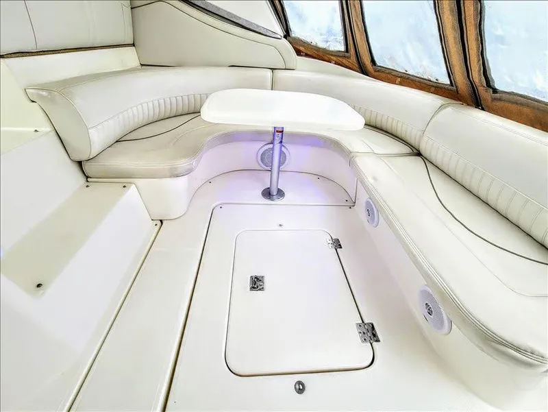 Slide: The Image of Interior of 2000 Cruisers Yachts 3672 Express with white leather seating. - 15
