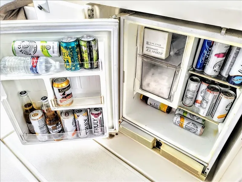 Slide: The Image of Fridge on 2000 Cruisers Yachts 3672 Express filled with assorted drinks. - 19