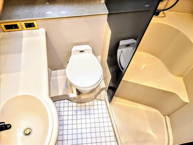 Slide: The Image of Bathroom of 2000 Cruisers Yachts 3672 Express with toilet and shower. - 23