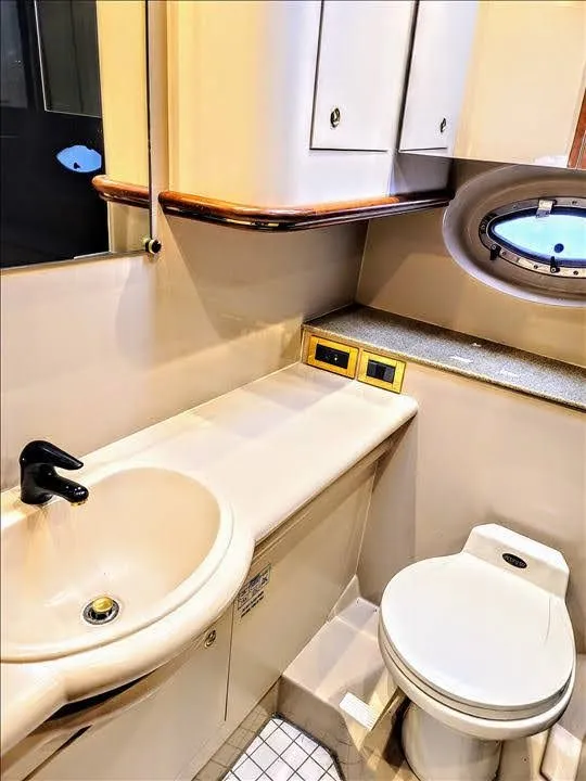 Slide: The Image of Bathroom of 2000 Cruisers Yachts 3672 Express with sink and toilet. - 24