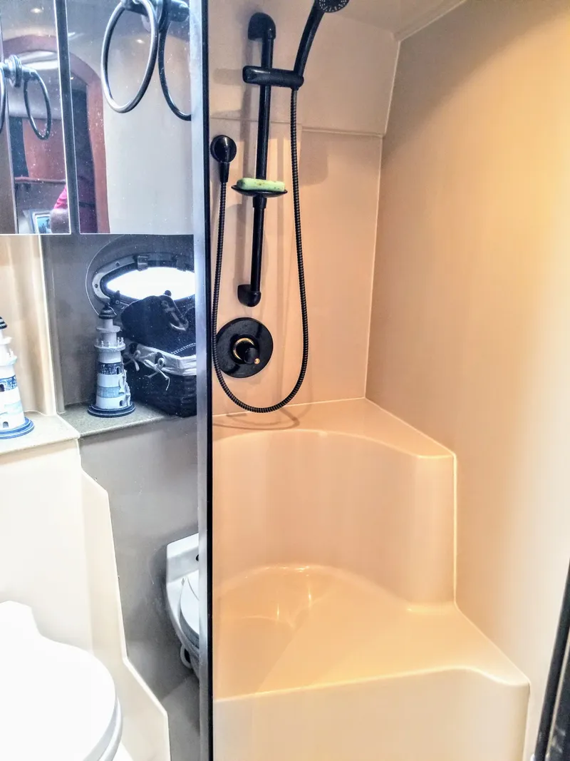 Slide: The Image of Cruisers Yachts 3672 Express 2000 bathroom with shower and mirror. - 25