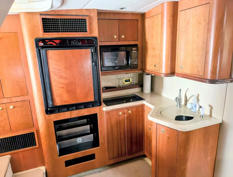 Slide: The Image of Kitchen area of the 2000 Cruisers Yachts 3672 Express. - 29