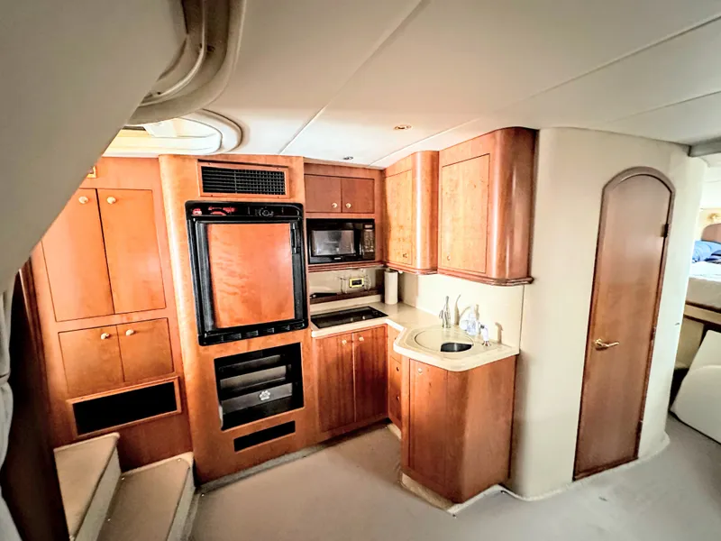 Slide: The Image of Interior of 2000 Cruisers Yachts 3672 Express with kitchen. - 34