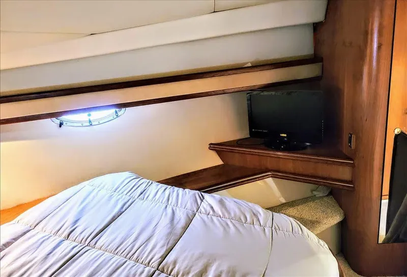 Slide: The Image of Interior of 2000 Cruisers Yachts 3672 Express with bed and TV. - 38