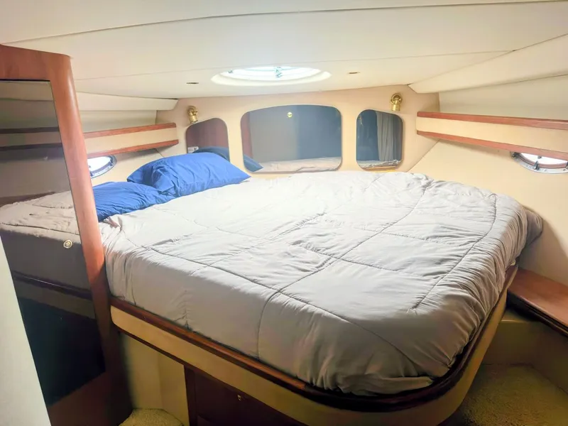 Slide: The Image of Interior of 2000 Cruisers Yachts 3672 Express with cozy bed. - 39