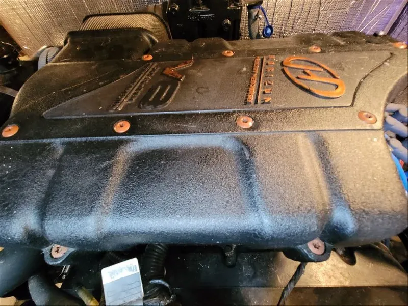 Slide: The Image of Engine cover of a 2000 Cruisers Yachts 3672 Express. - 43