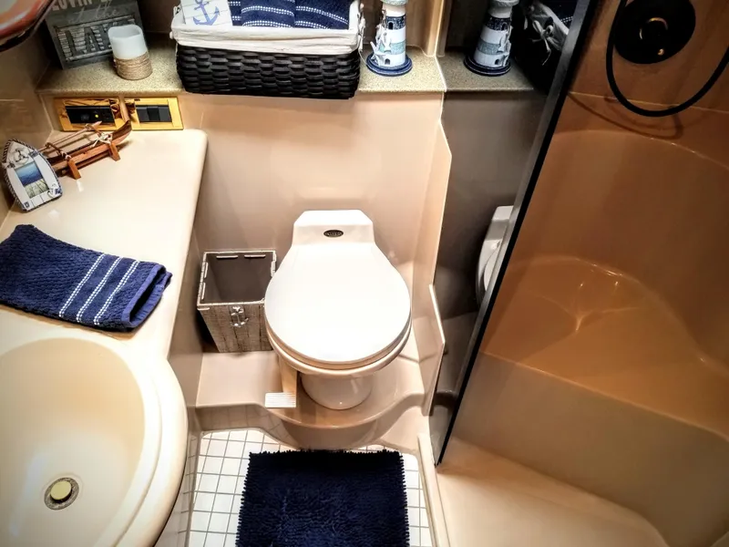 Slide: The Image of Luxurious bathroom in a 2000 Cruisers Yachts 3672 Express. - 48