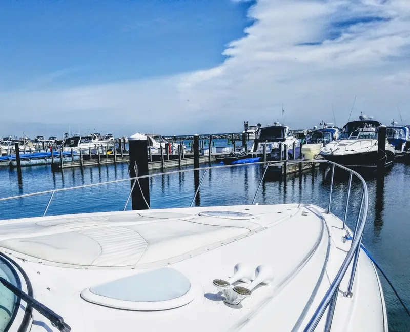 Slide: The Image of Cruisers Yachts 3672 Express 2000 docked in marina on sunny day. - 5