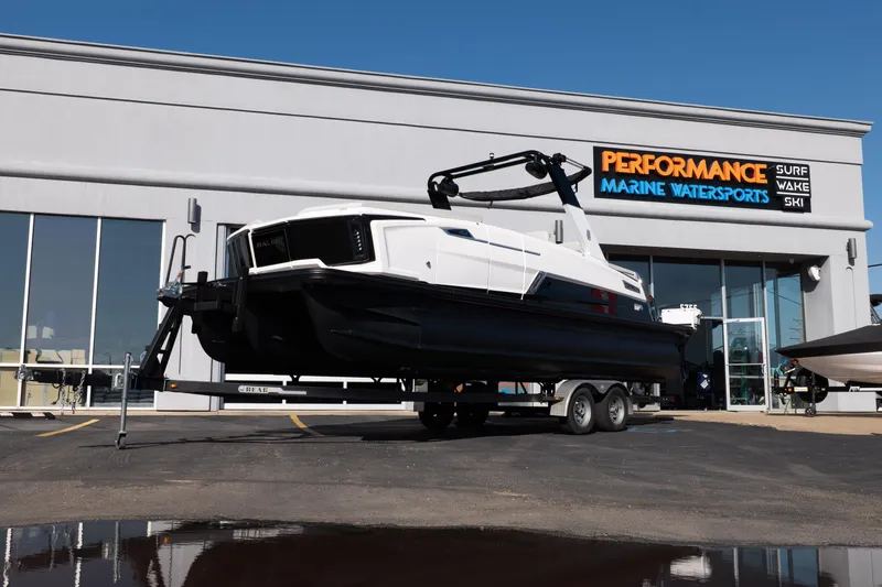 The Image of 2025 Balise Helix 24C boat on trailer at Performance Marine Watersports dealership. - 0