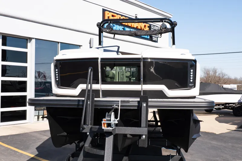 Slide: The Image of 2025 Balise Helix 24C boat on trailer outside dealership. - 12