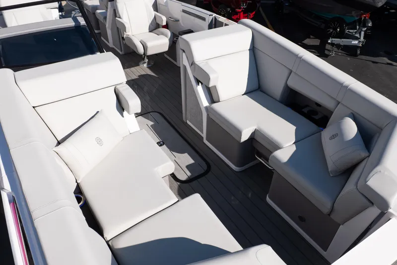 Slide: The Image of Luxurious seating on the 2025 Balise Helix 24C boat, featuring plush white upholstery. - 24